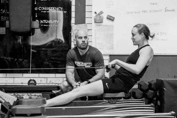 Woman working out with coach
